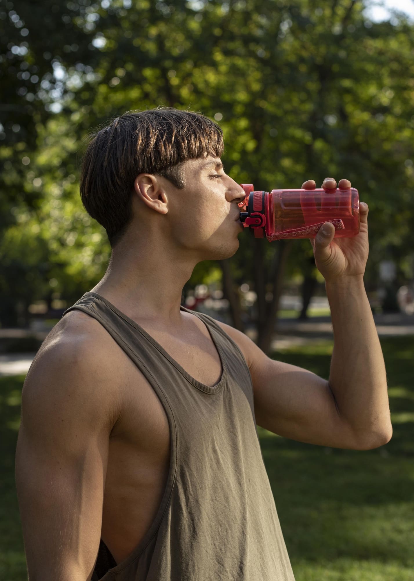 side-view-man-drinking-water-after-working-out-outdoors